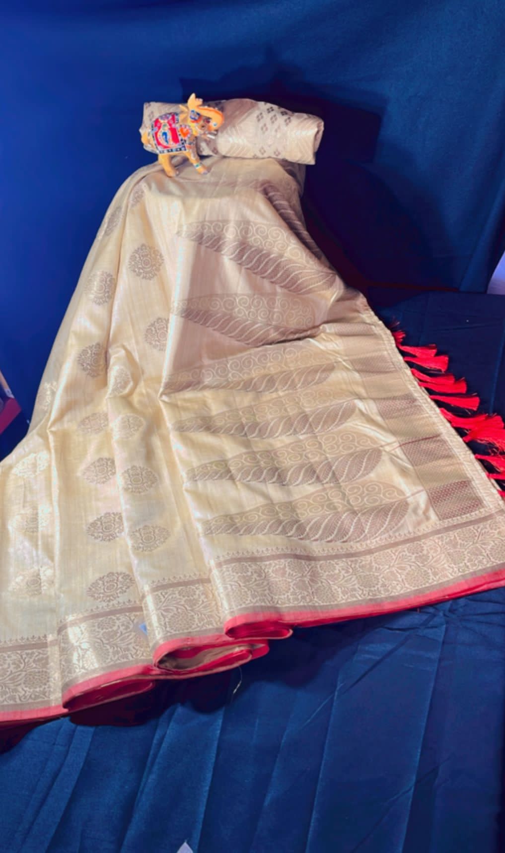 Soft silk saree with golden zari work and beautiful tassels