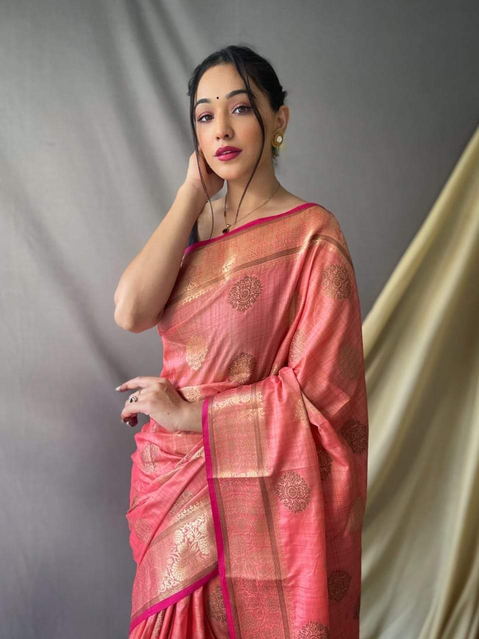 Soft silk saree with golden zari work and beautiful tassels