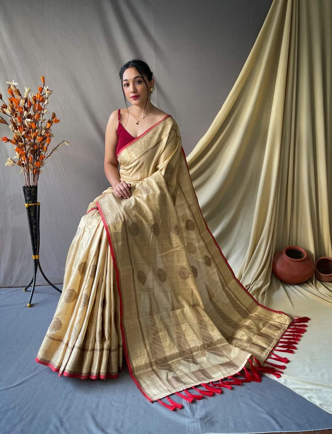 Soft silk saree with golden zari work and beautiful tassels