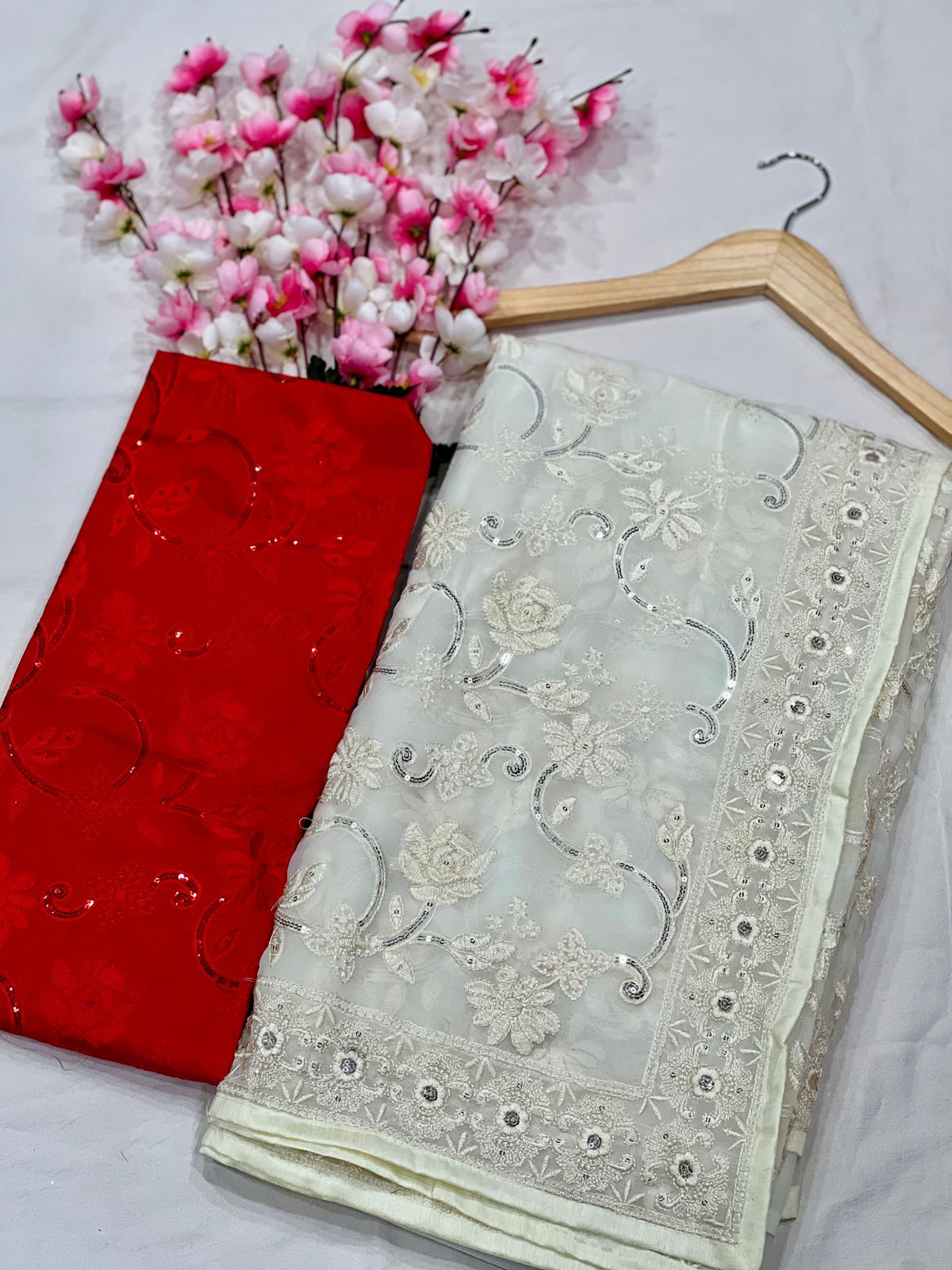 The designer white and red Saree