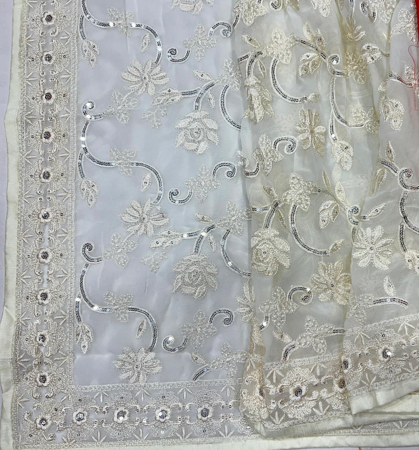 The designer white and red Saree