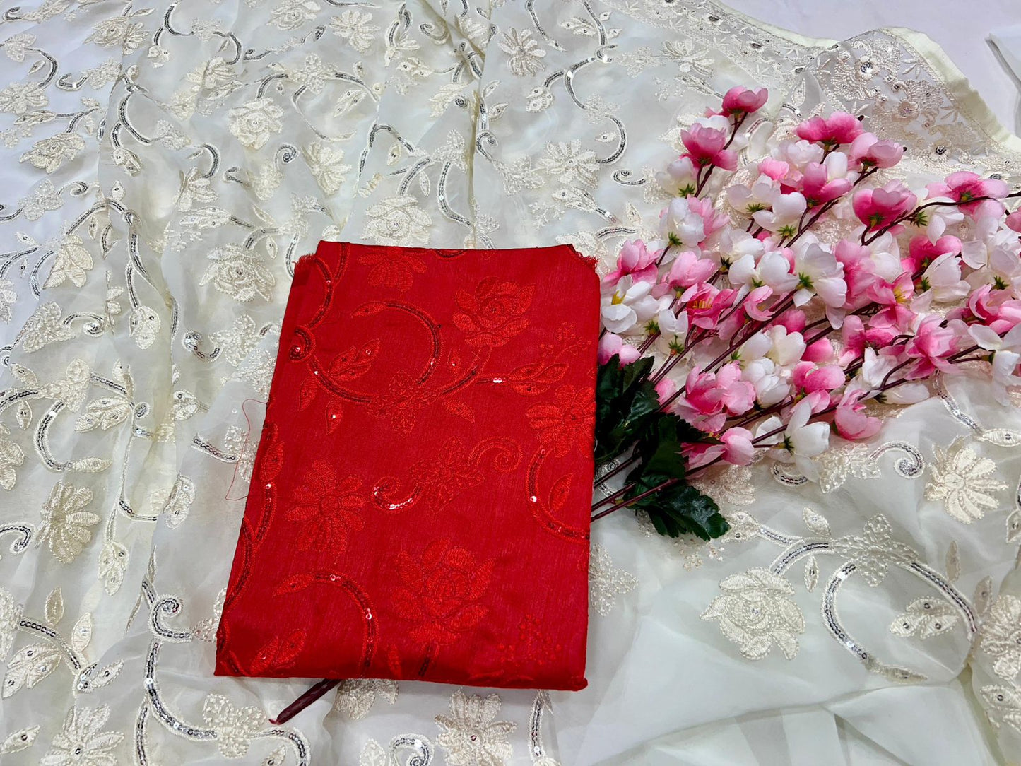 The designer white and red Saree