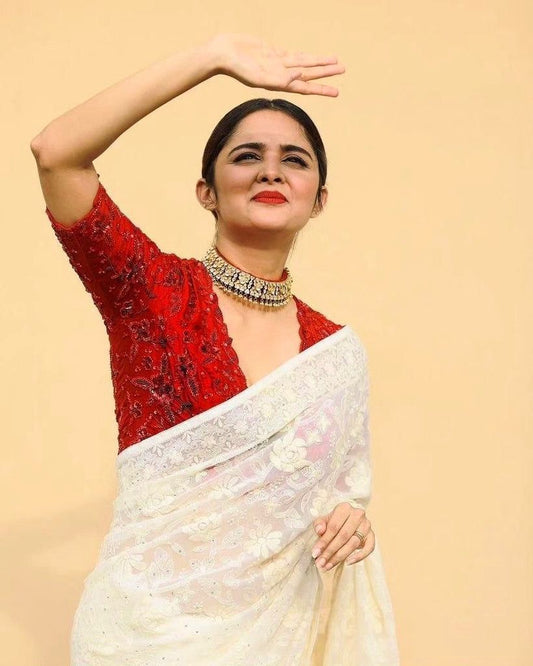 The designer white and red Saree